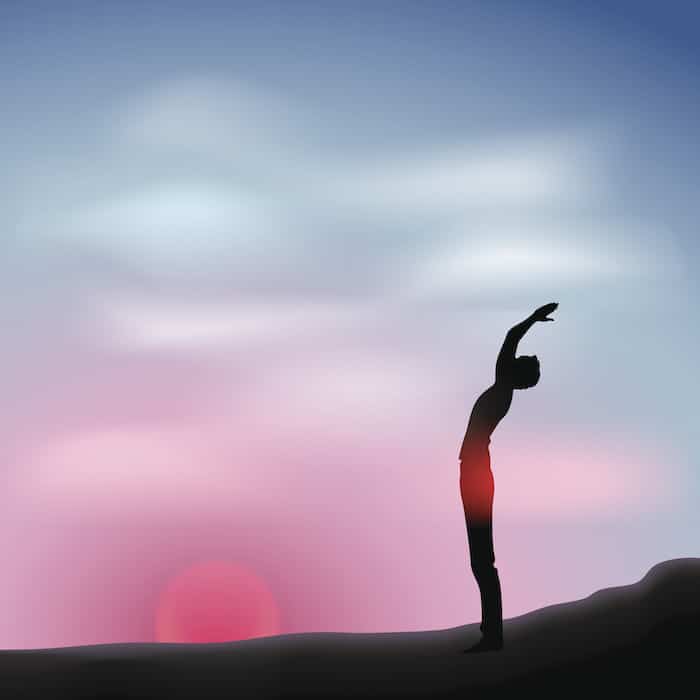 Man in the morning Male silhouette in relaxing pose on the morning landscape